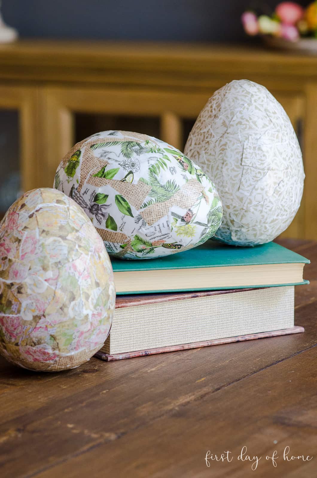 Decoupage Easter eggs sitting on old books
