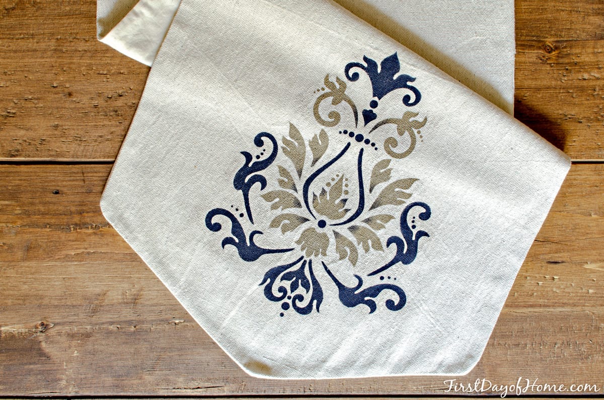 Custom table runner made using drop cloth and acrylic paint with DecoArt stencil