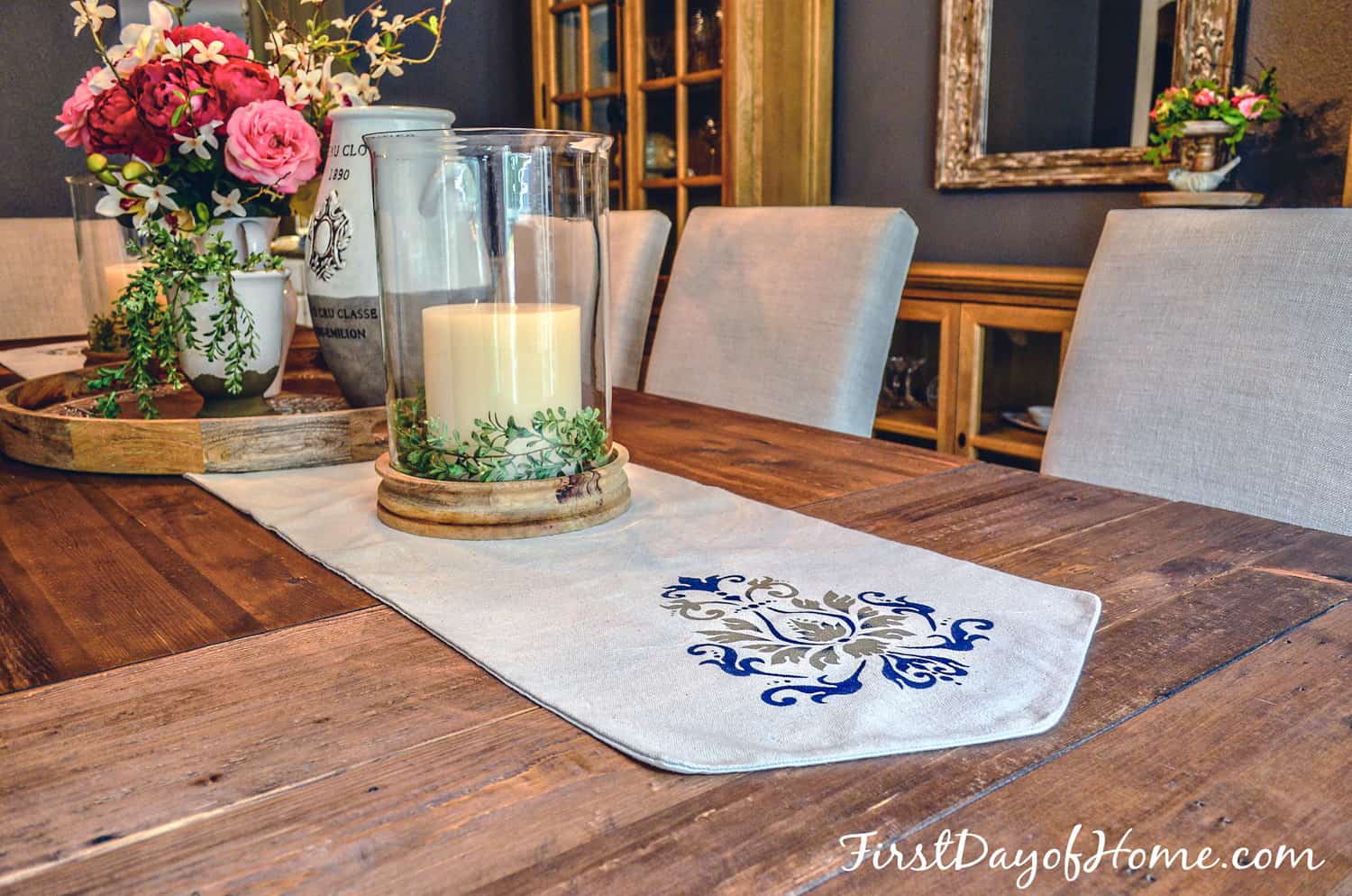 Finished DIY table runner with stenciled design shown on dining room table