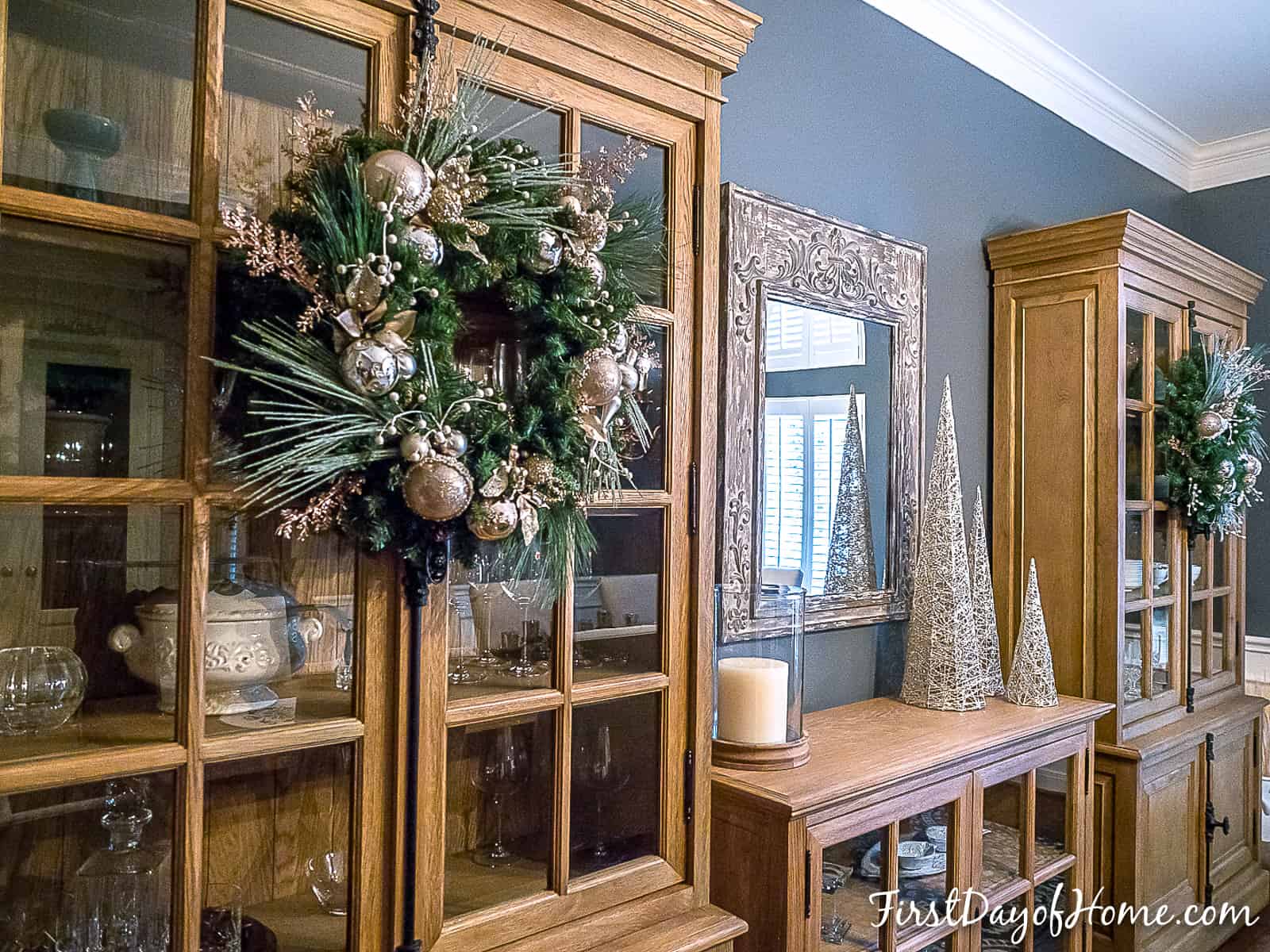 Homemade Christmas wreath hanging on cabinet