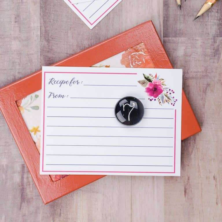 Magnetic photo frame with floral background used as a recipe card holder
