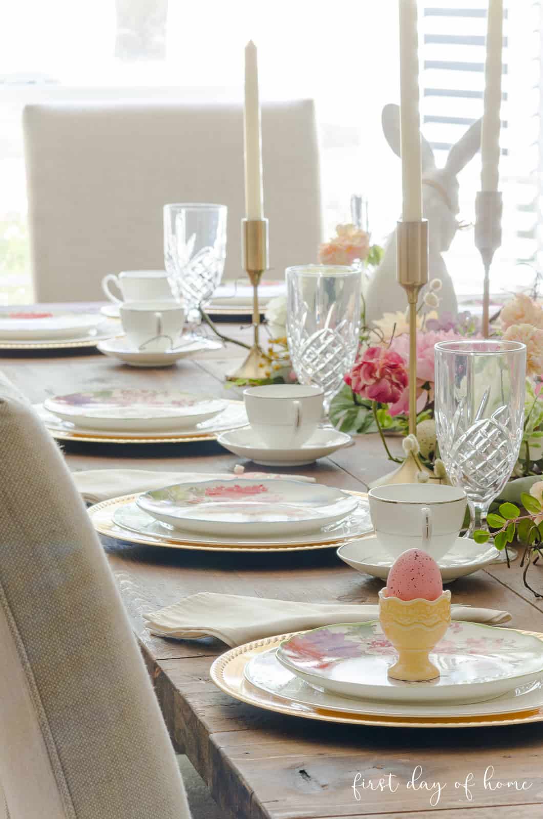 Easter tablescape with place settings in pastel color theme