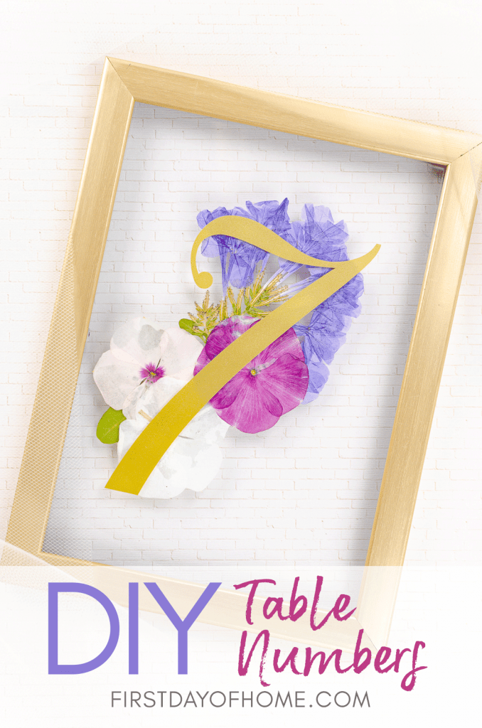 Wedding table number holders using pressed flowers and gold frames
