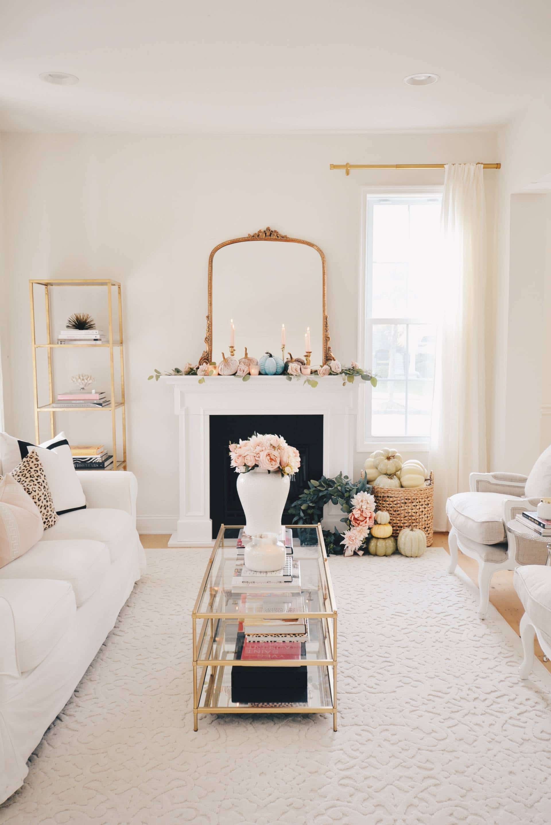 Pink and blush fall decor on mantel in living room