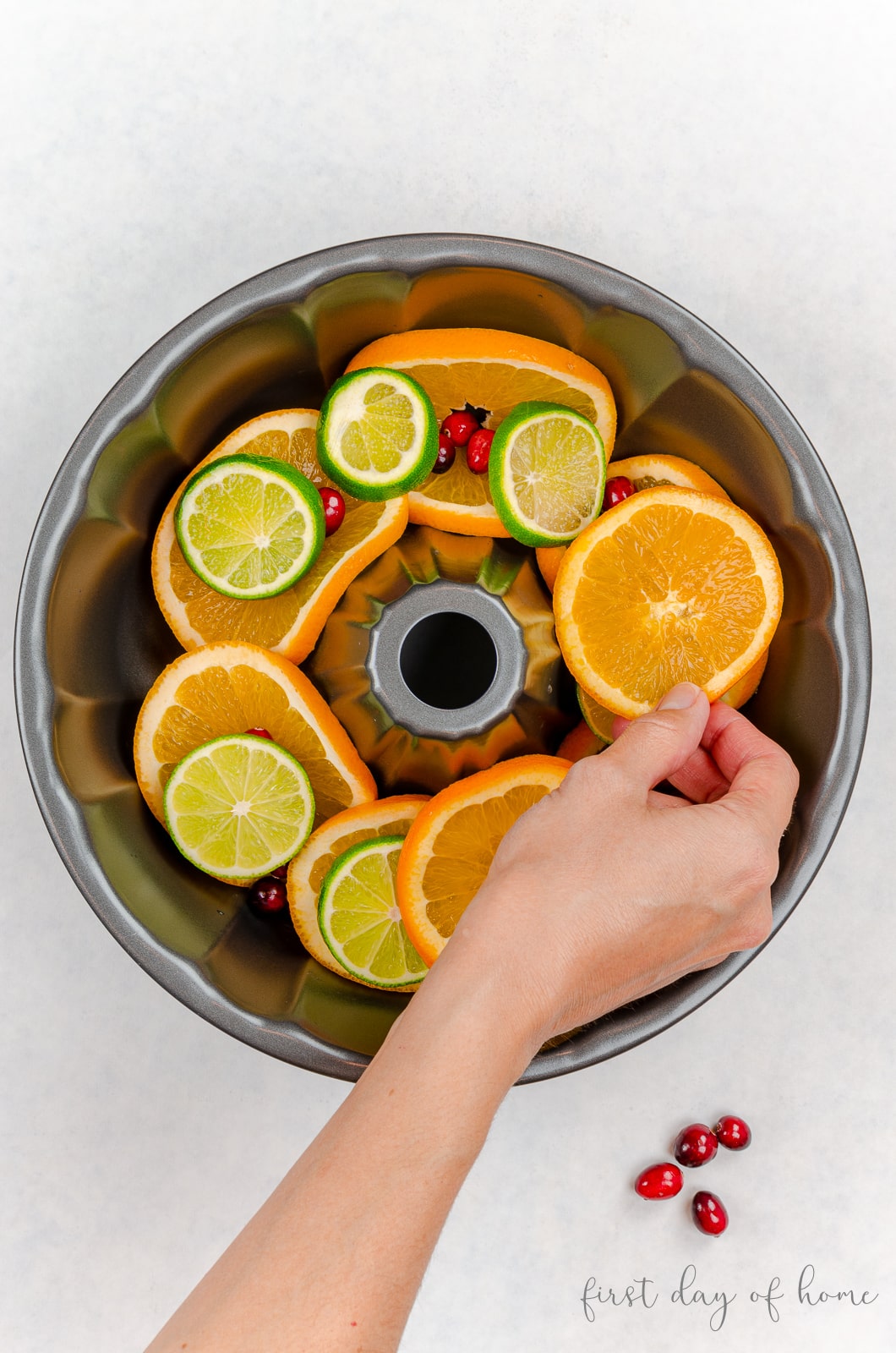 Layering citrus fruit into bundt cake pan
