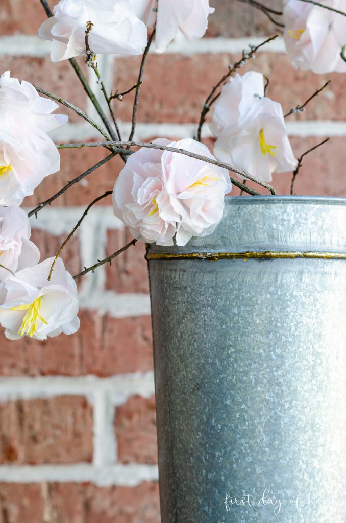Cherry blossom paper flowers in galvanized metal bucket