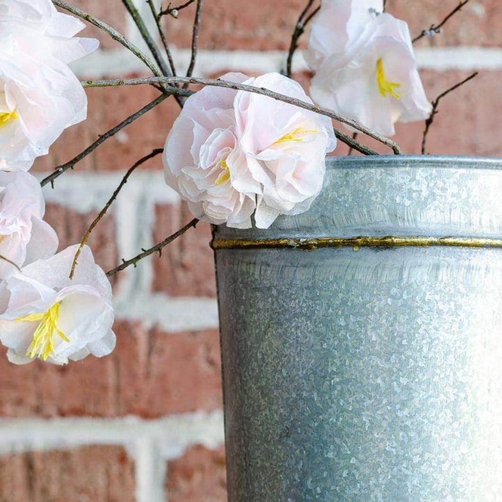 Cherry blossom paper flowers in galvanized metal bucket