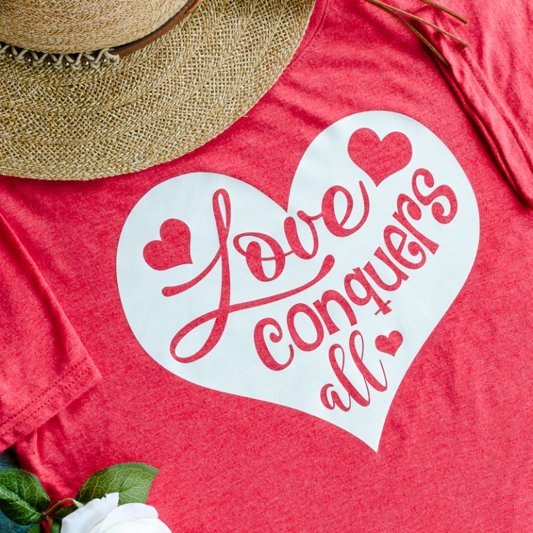 Love SVG file with phrase Love Conquers All