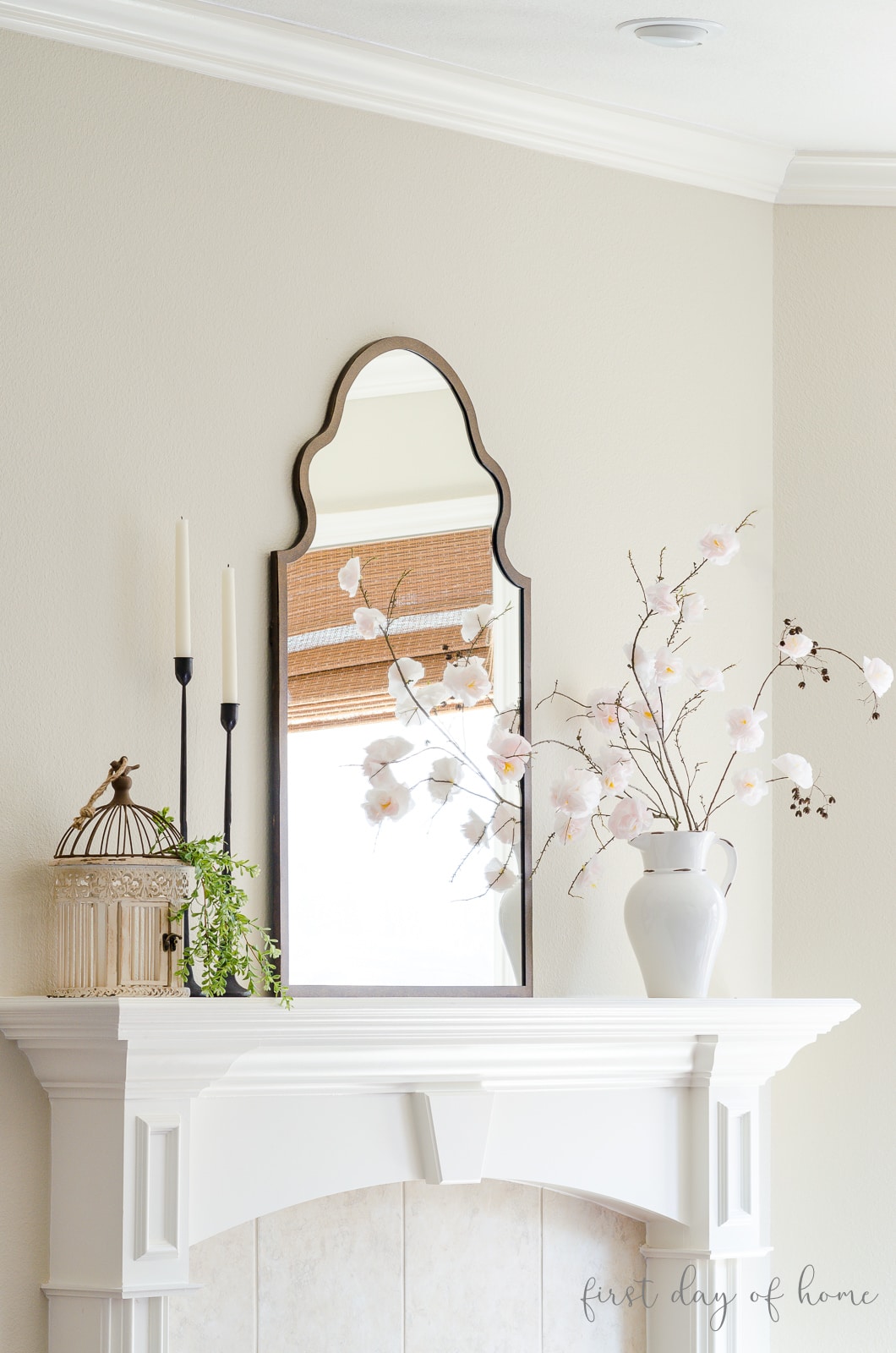 Spring mantel with DIY faux cherry blossoms, mirror and candlesticks