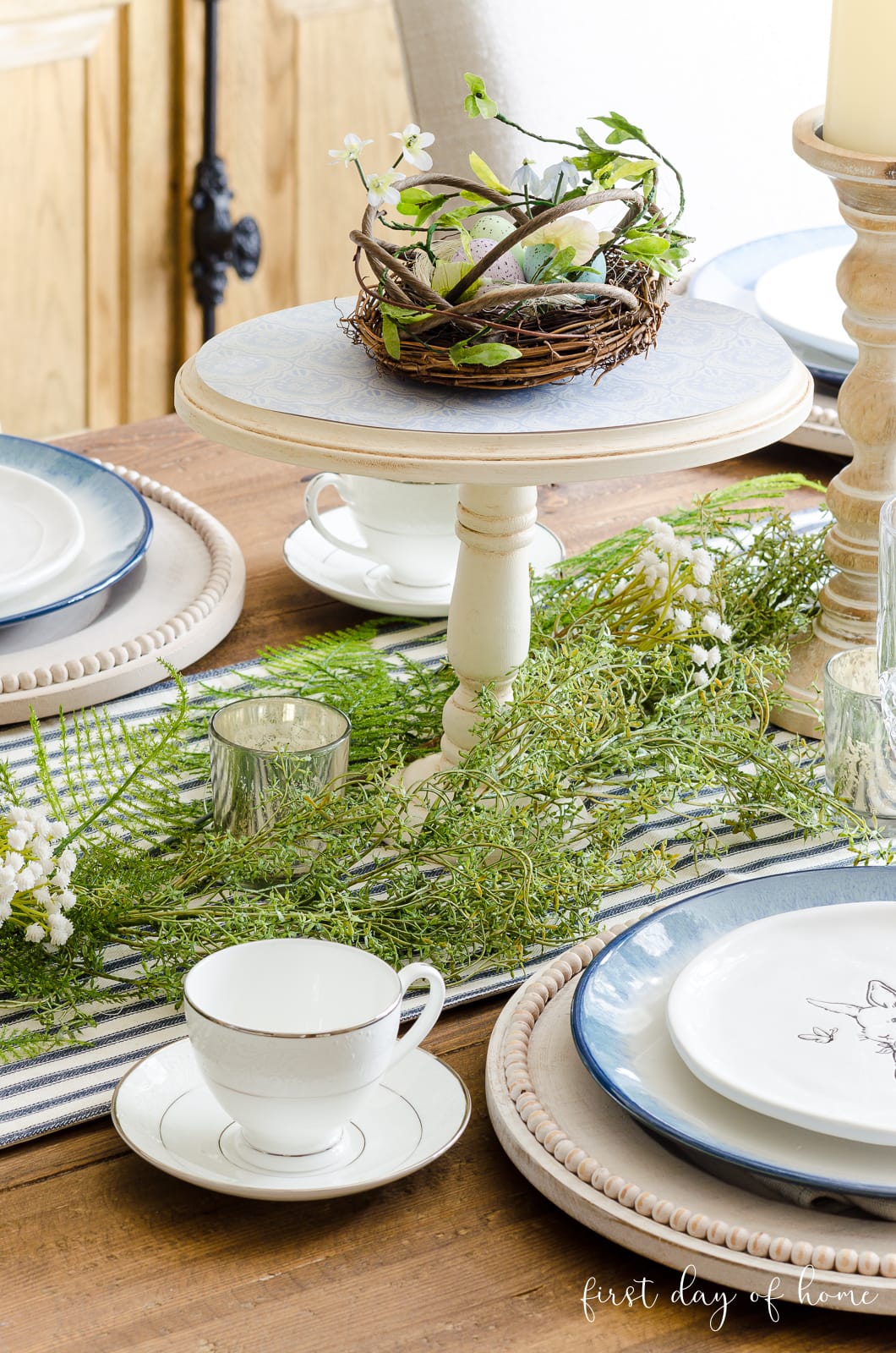 DIY cake stand with bird's nest on spring table