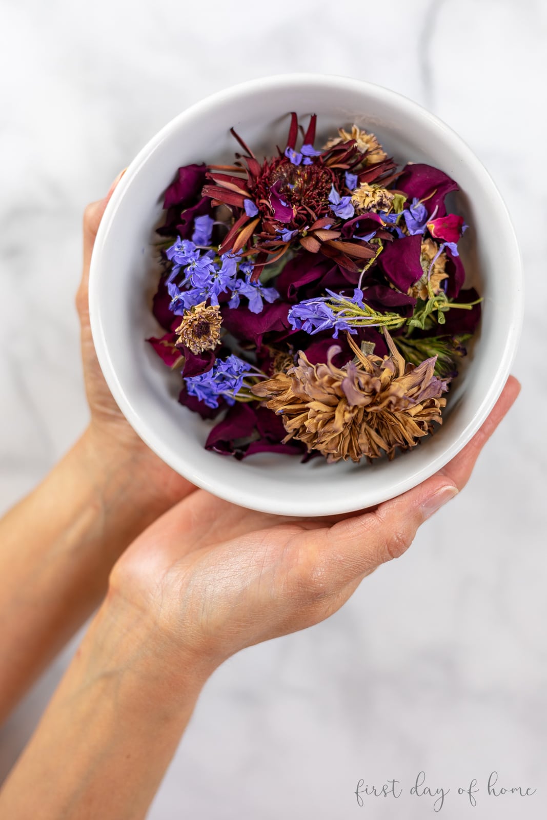 Mix of dried flowers in a bowl before making into potpourri