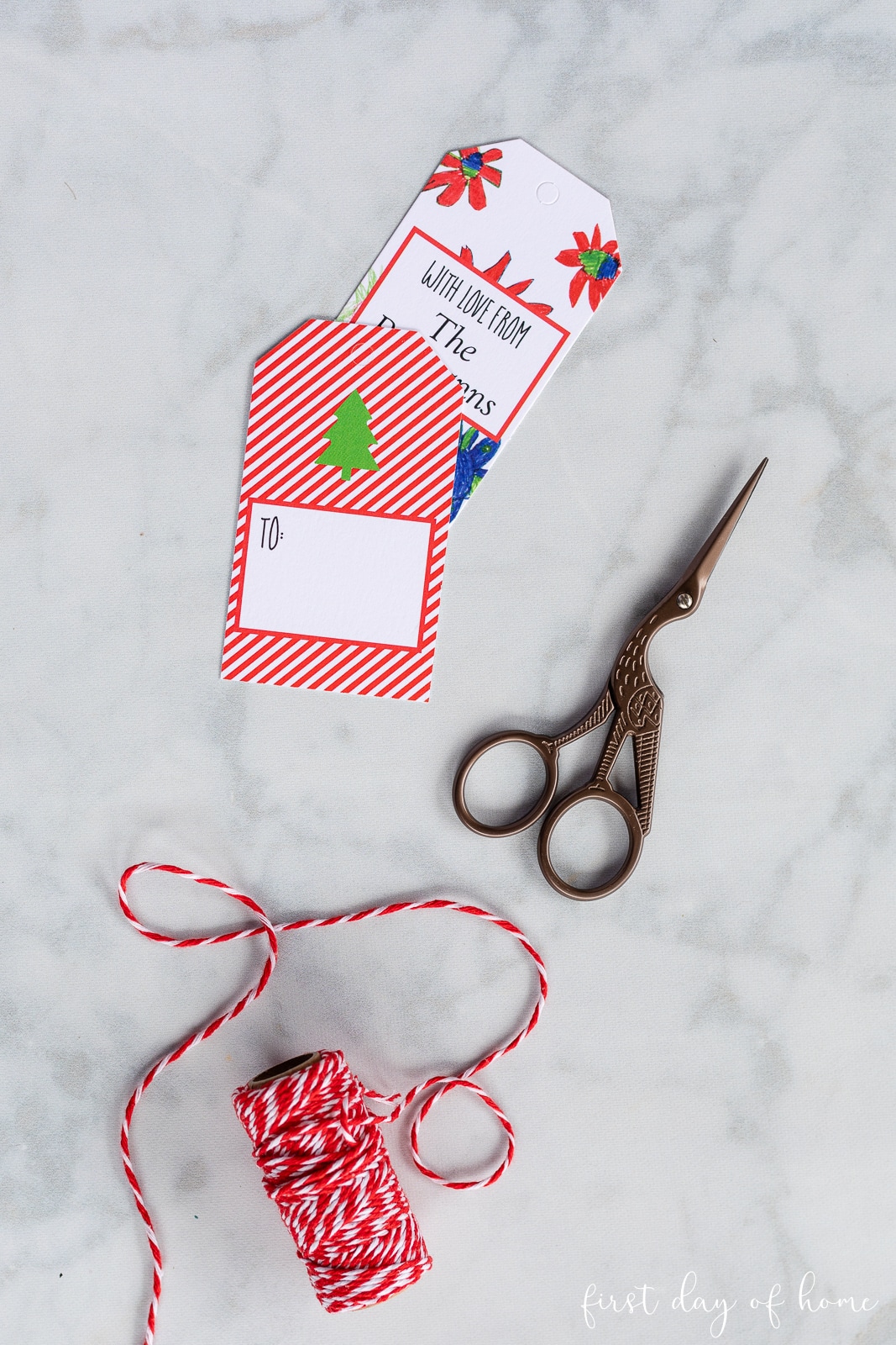 Personalized gift tags with red baker's twine and scissors
