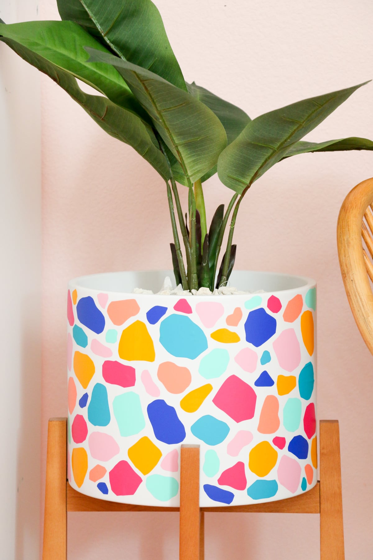 Terrazo style stand planter that looks painted by using colorful vinyl shapes