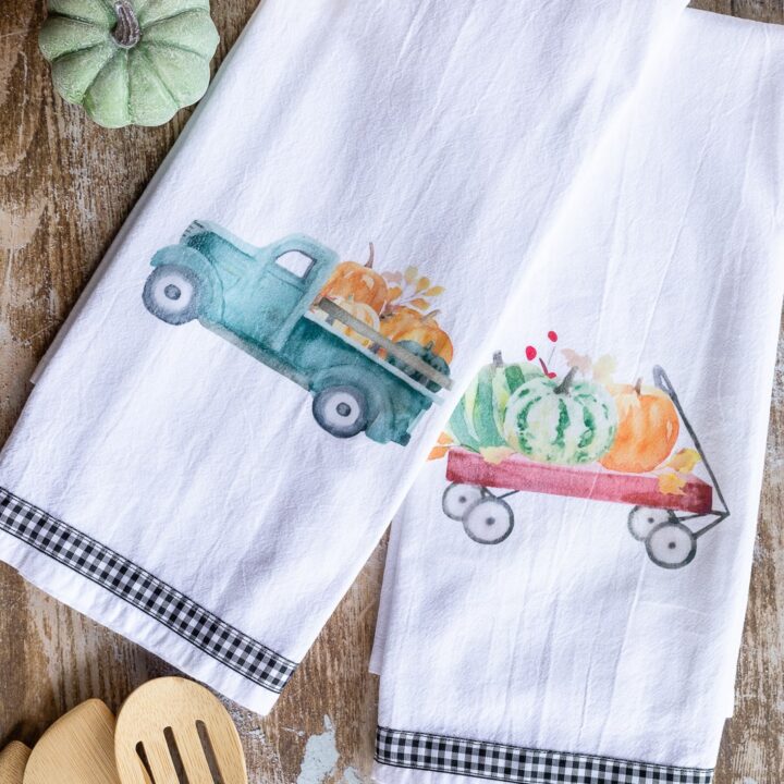 DIY tea towels made with image transfers showing farmhouse pumpkin wagon and truck theme