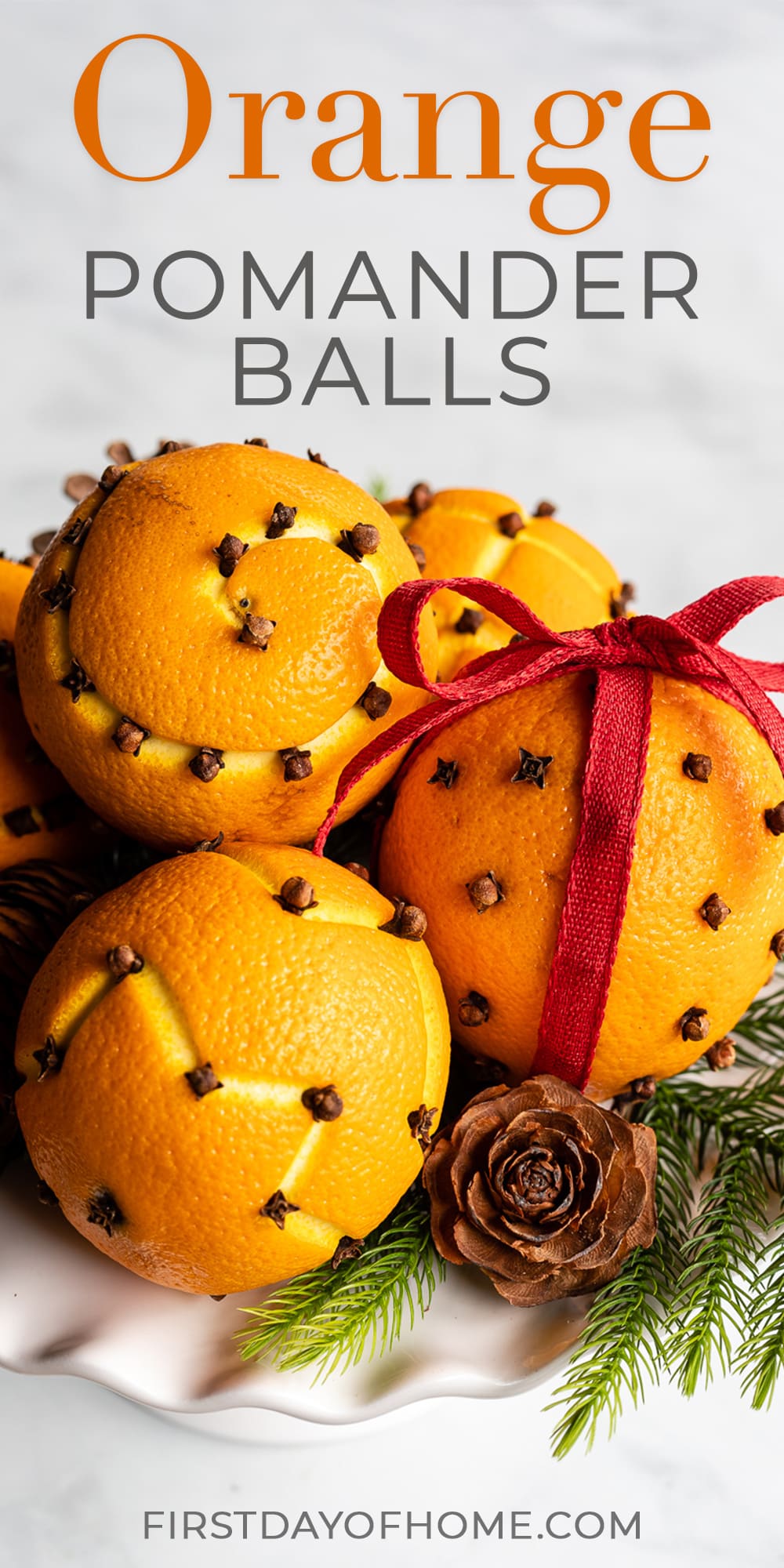 Orange pomander balls with cloves and text overlay reading "Orange Pomander Balls"