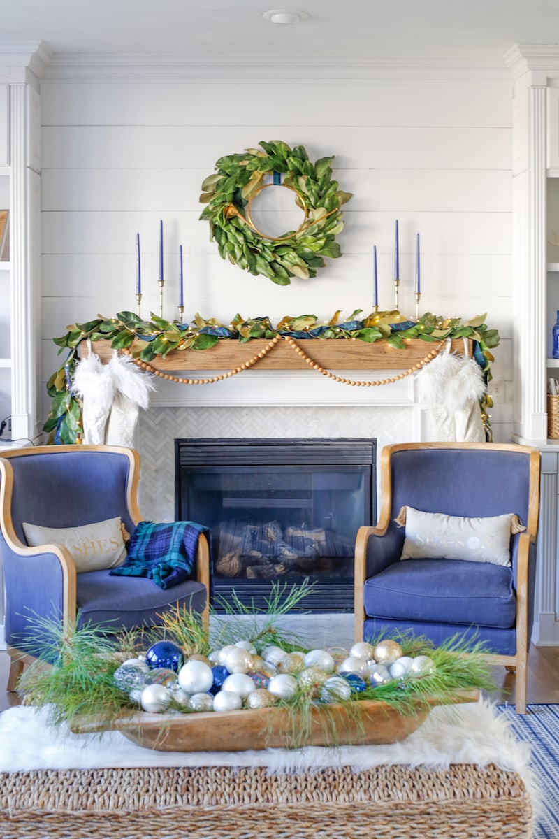 Christmas mantel decor with blue and green plaid color scheme, including matching wreath and garland