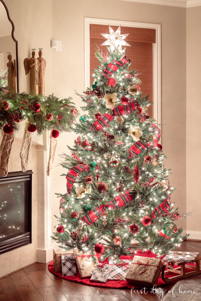 Christmas tree decorations and Christmas mantel at night
