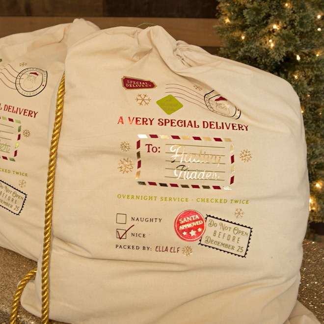 Personalized Santa bags made using Cricut vinyl transfer