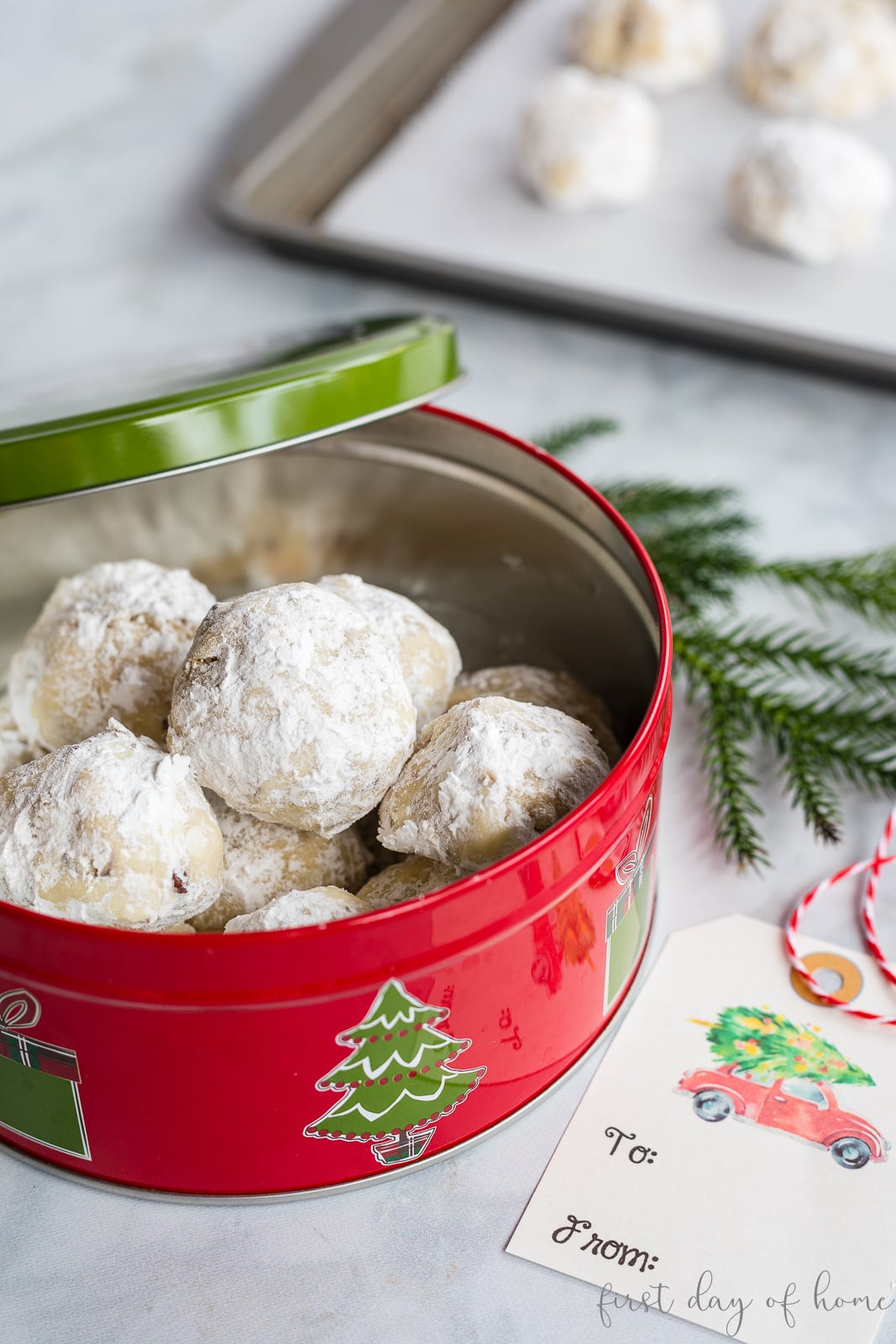 Pecan sandies cookies in Christmas tin with gift tag