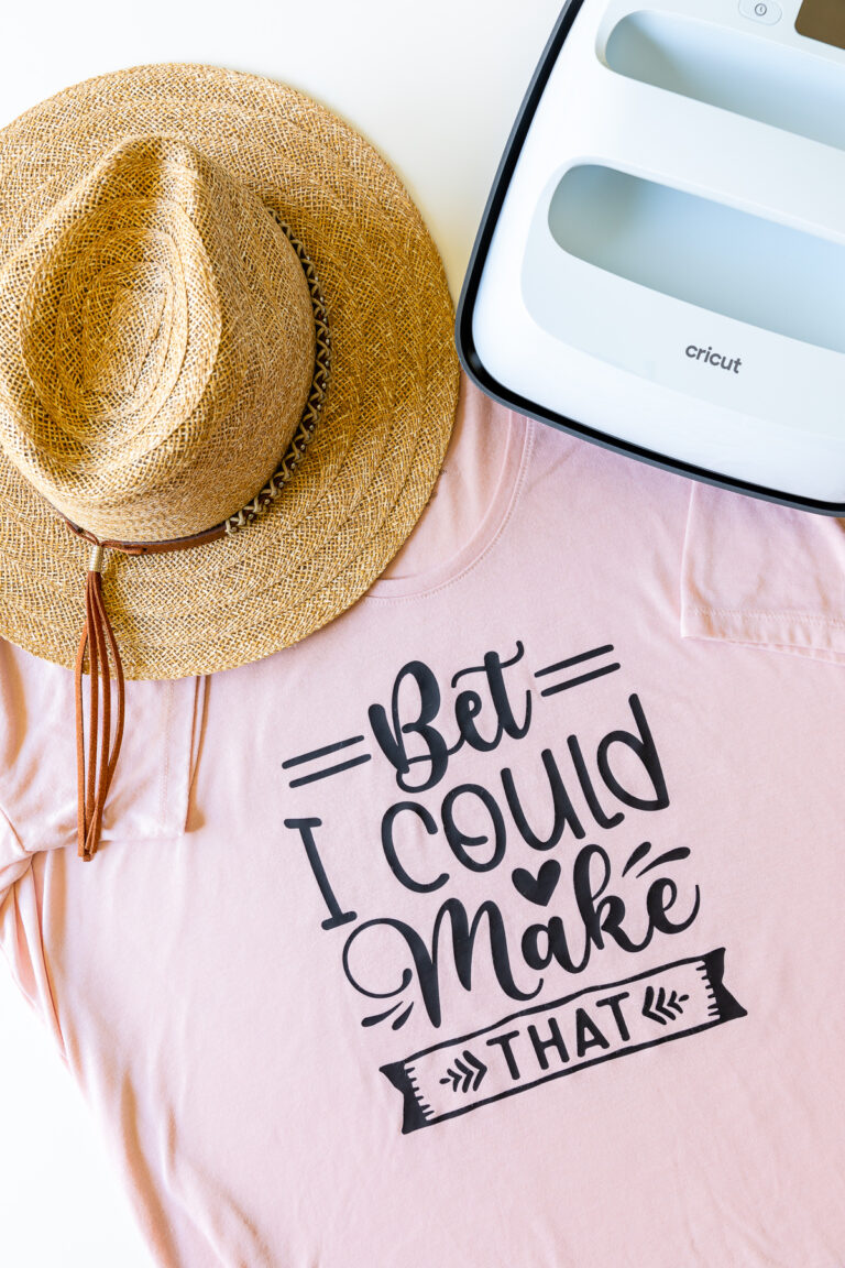 Cricut EasyPress 3 shown with t-shirt made with heat-transfer vinyl and straw hat