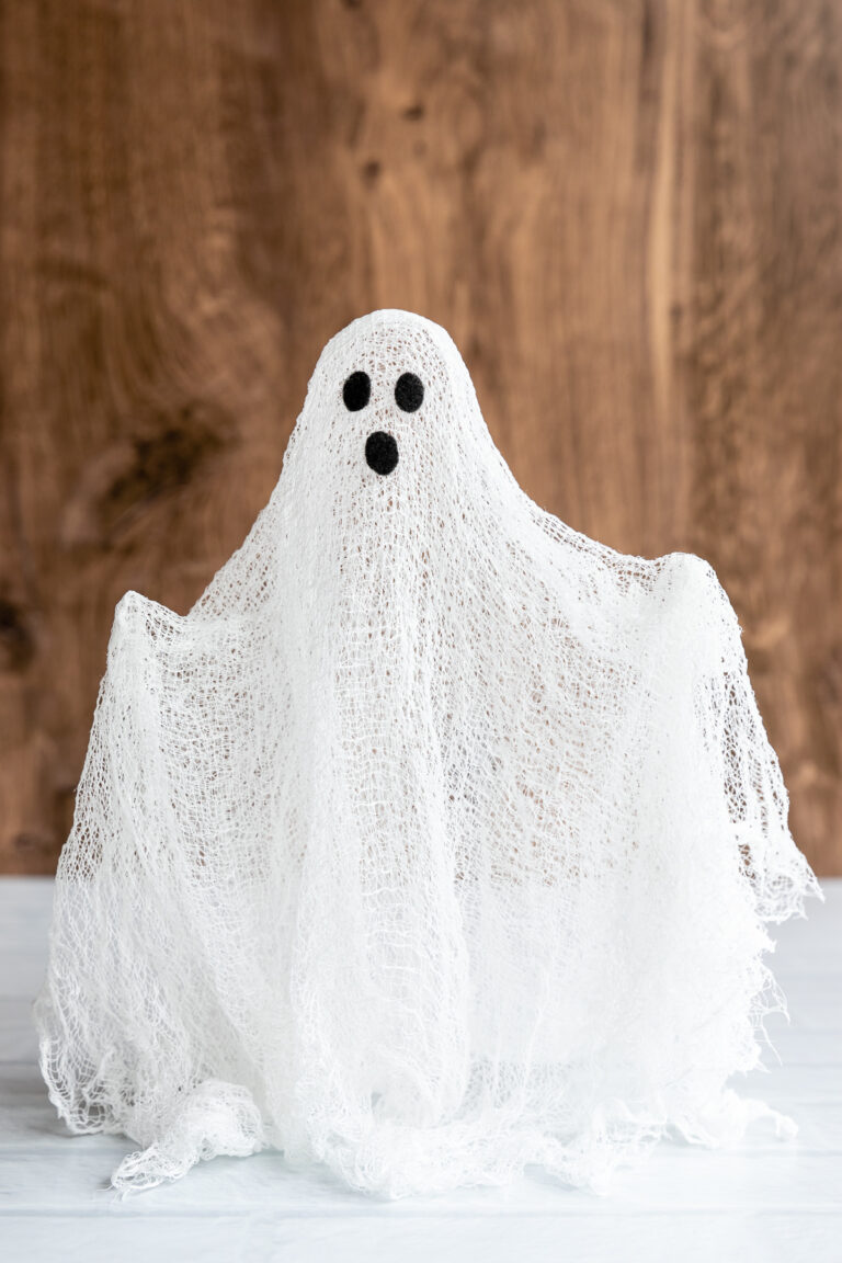 Cheesecloth ghost with arms extended
