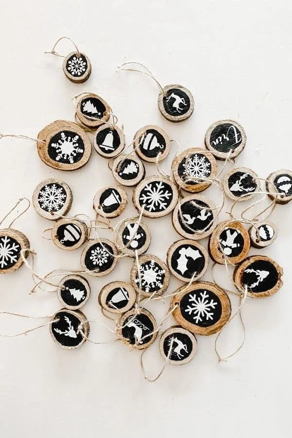 Black and white wood slice ornaments made with Cricut