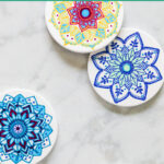 Infusible ink coasters with ornate mandala design. Text overlay reads "Cricut Infusible Ink Coasters"