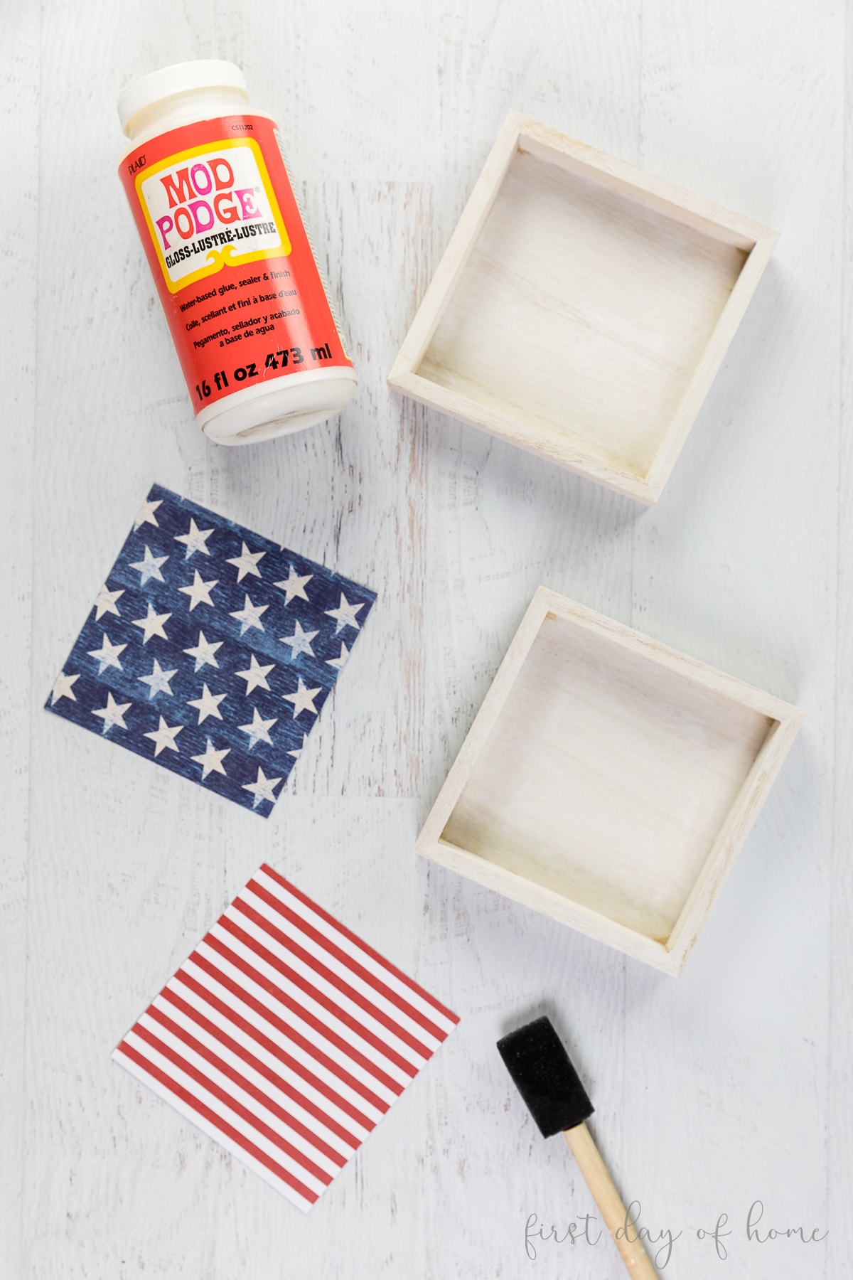 Applying Mod Podge to the wooden boxes to make patriotic wood signs