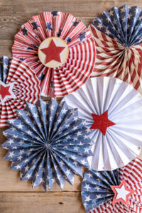 Paper fans with various shapes, sizes, and patterns in patriotic styles