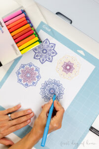 Hand coloring mandala designs with Cricut infusible ink pens and markers