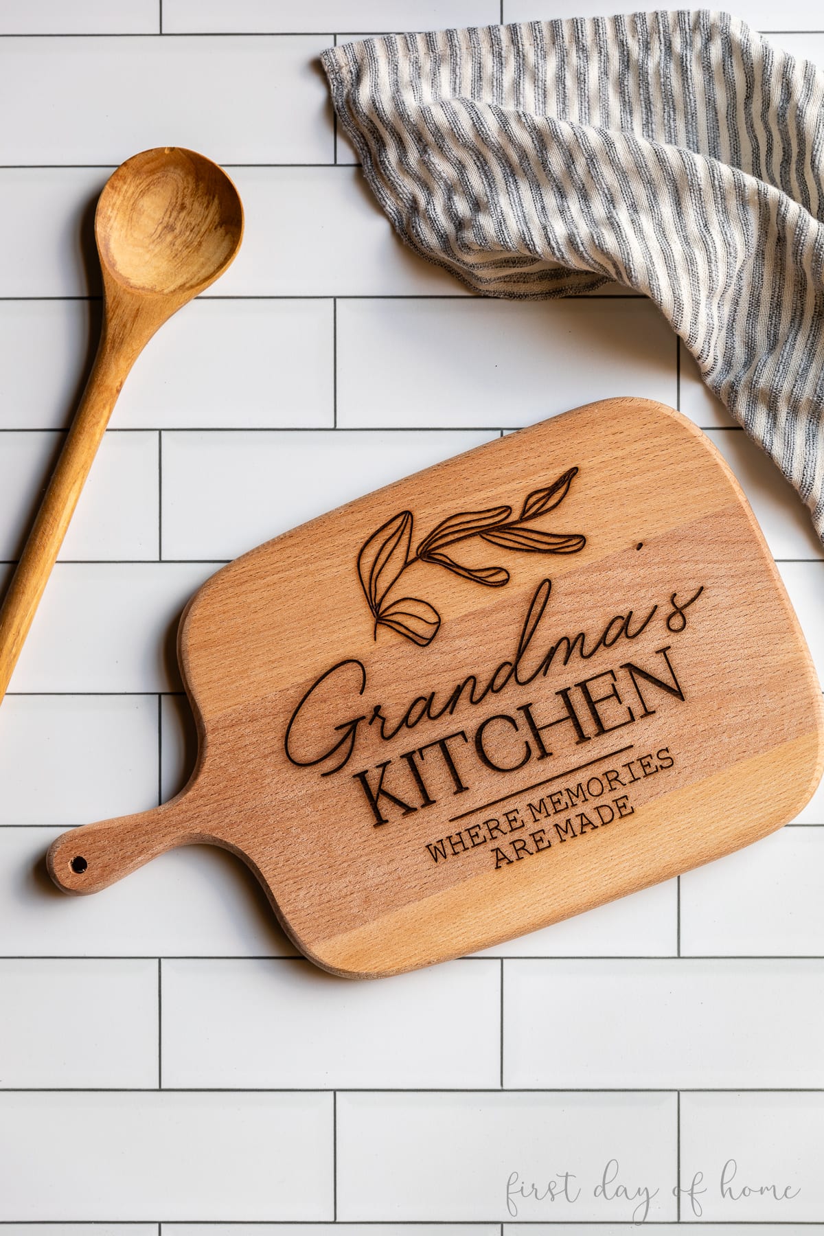 Personalized cutting board that reads "Grandma's Kitchen: Where Memories are Made".