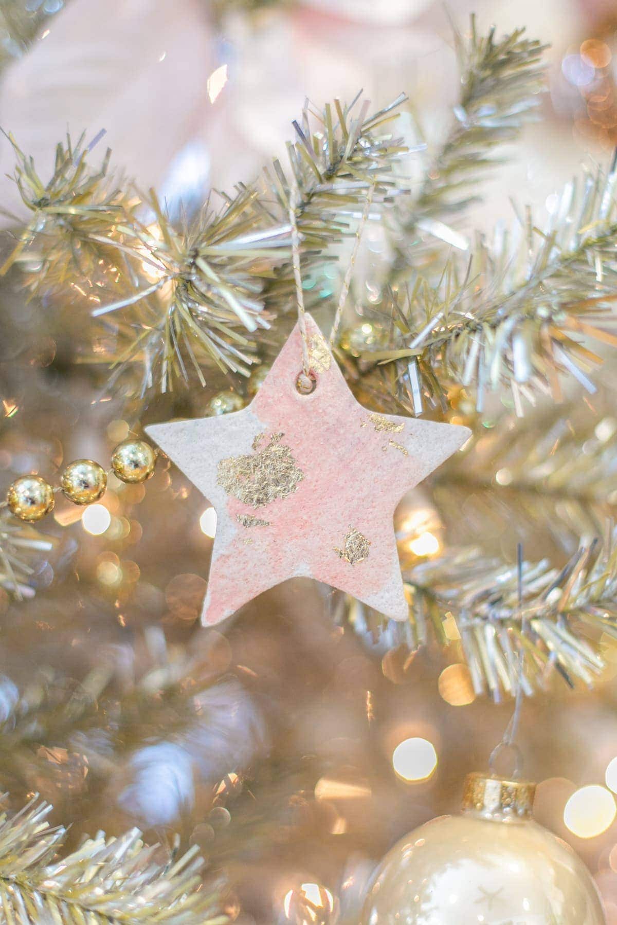Star shaped salt dough ornament with gold accents.
