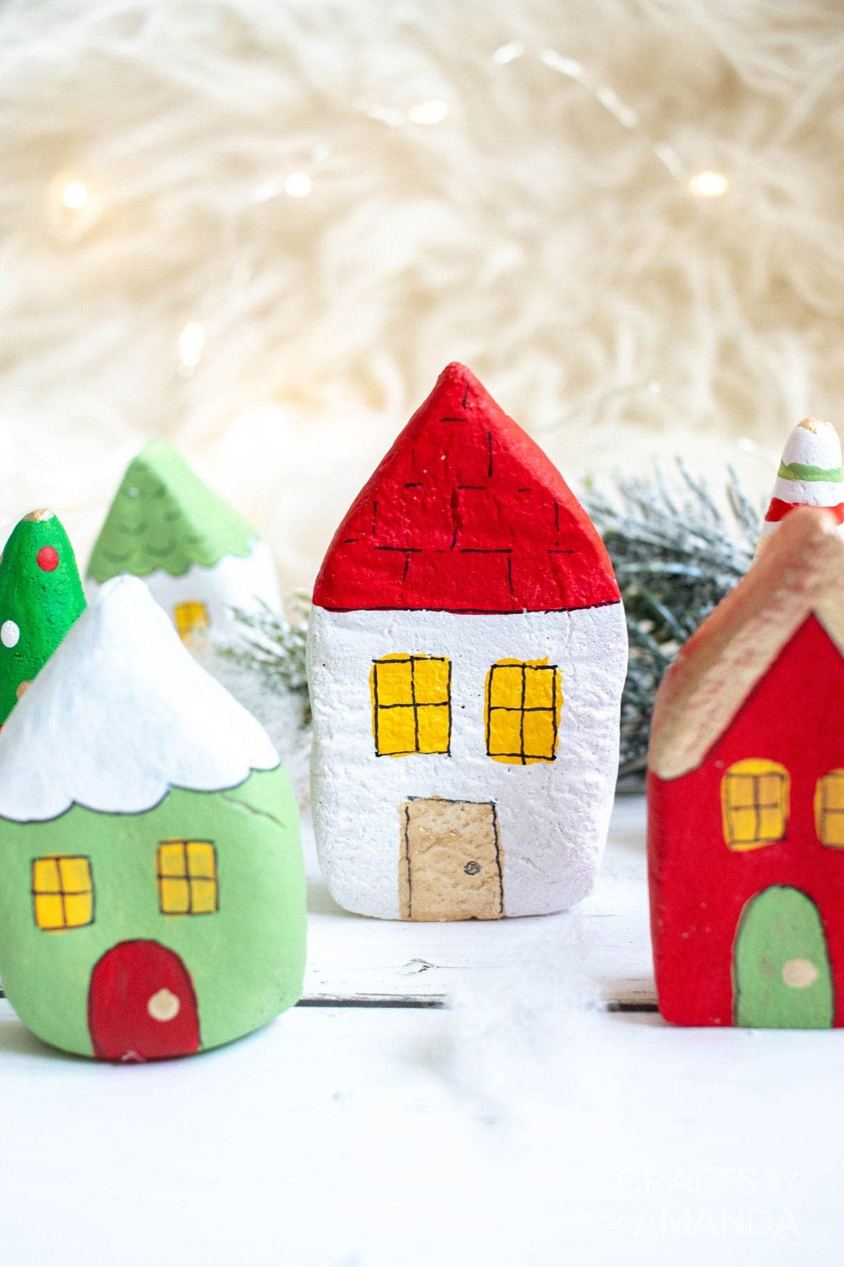 Salt dough houses painted in Christmas colors.