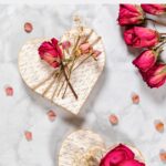 Wooden hearts decorated with decoupage paper and dried flowers.