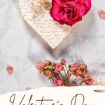 Wood heart with decoupage pattern and dried rose.