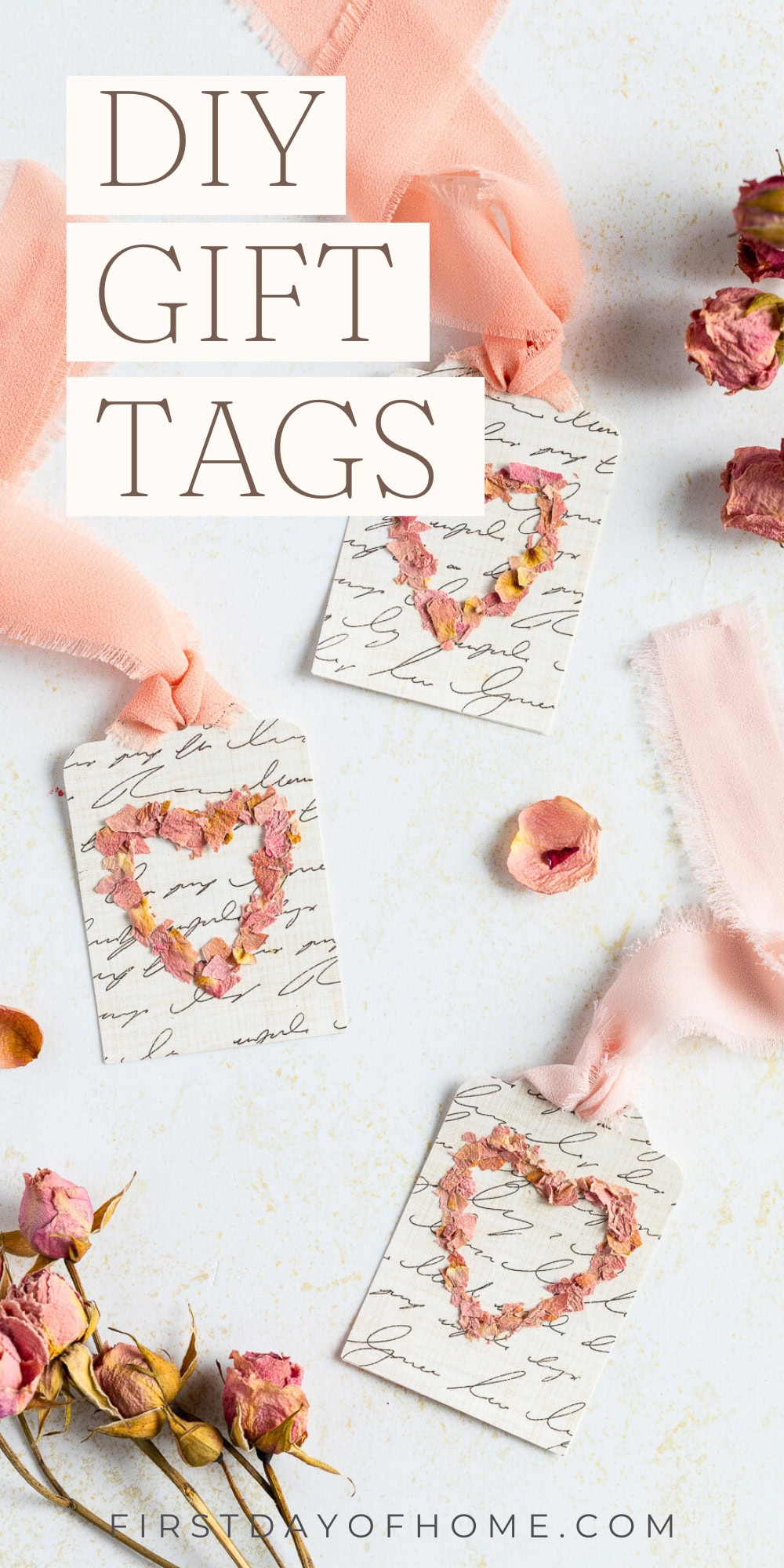 Gift tags with script font scrapbook paper and dried flower petals in the shapes of hearts.