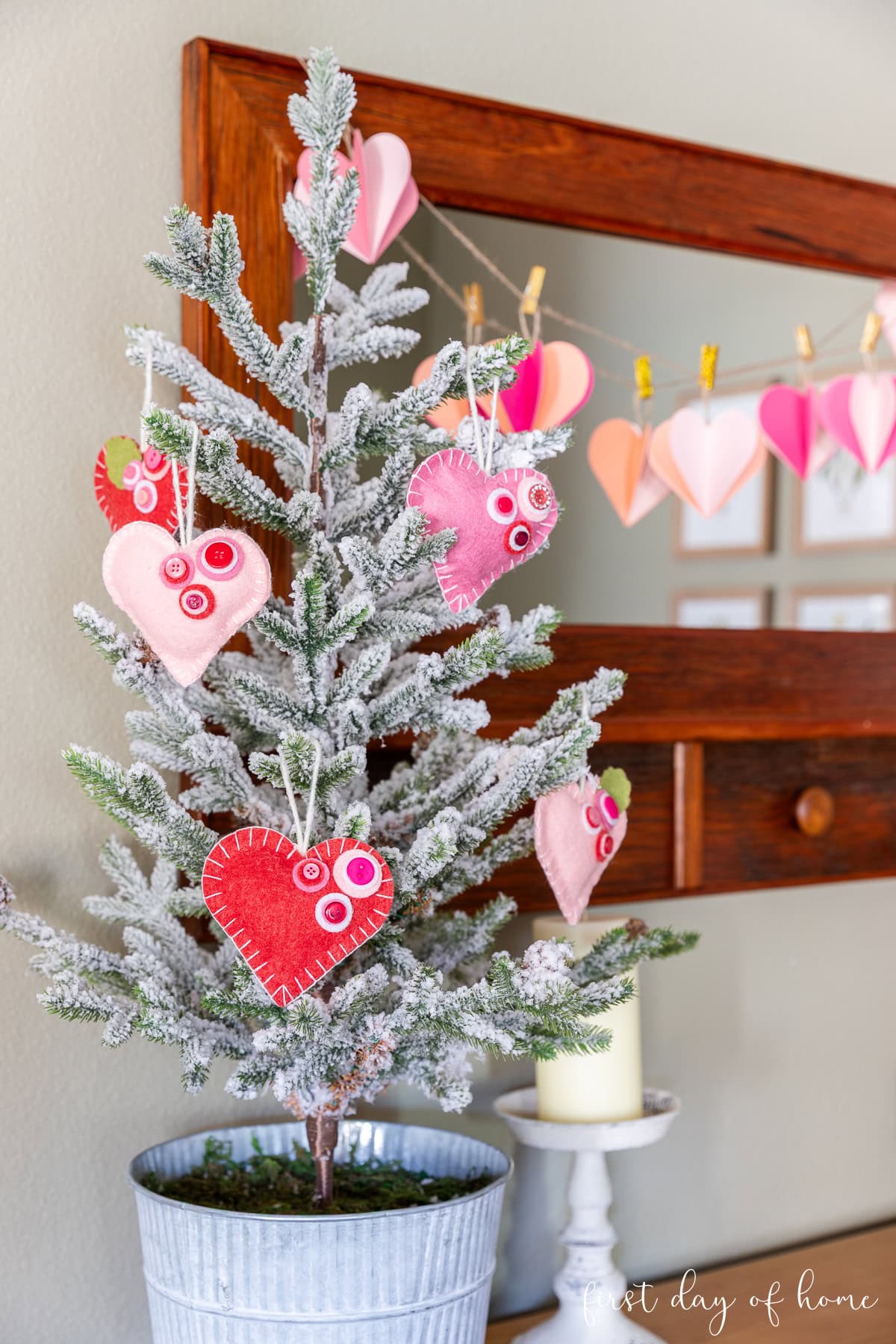 Flocked tabletop Valentine's Day tree with felt heart ornaments.