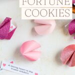 Paper fortune cookies scattered with printed fortune messages.
