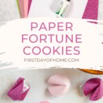 Supplies to make paper fortune cookies and finished paper fortune cookies in various shades of pink.