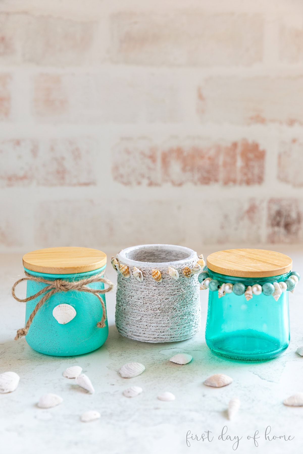 Three coastal glass jars painted and decorated with Mod Poget, paint, and food coloring.