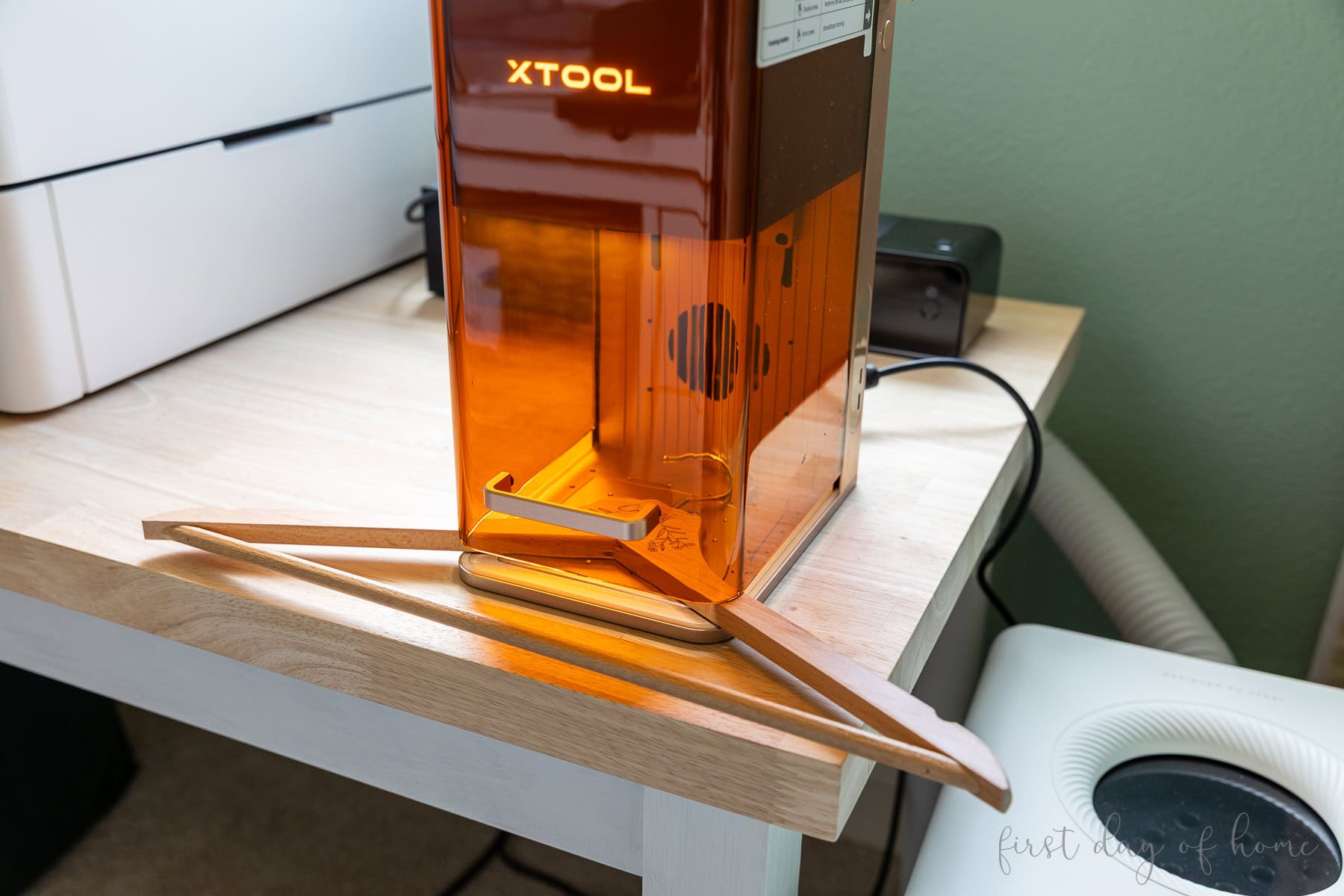 Laser engraving a wooden hanger in the xTool F2 laser machine.