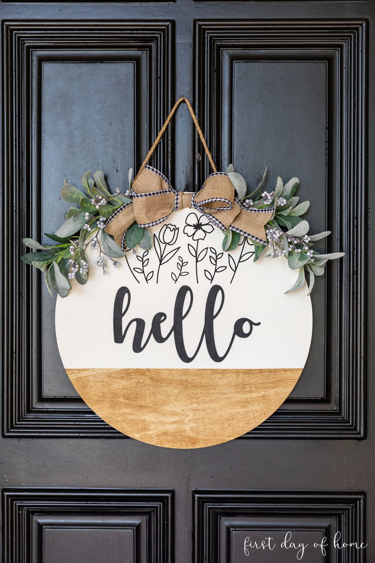 Round wood wreath with iron-on vinyl decal and wood text that reads "hello" made with a Cricut Maker 5.